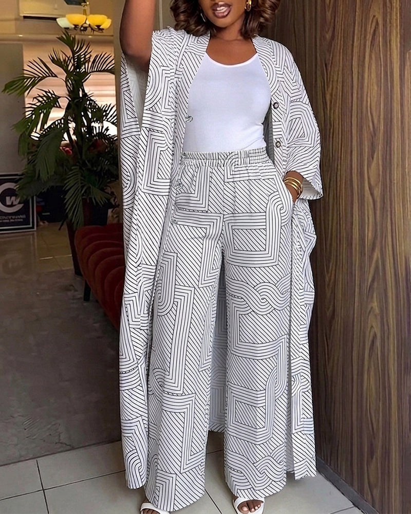 Alira™ | Tweedelige set met geometrische print: loszittende, lange jas met vleermuismouwen en broek met hoge taille en wijde pijpen