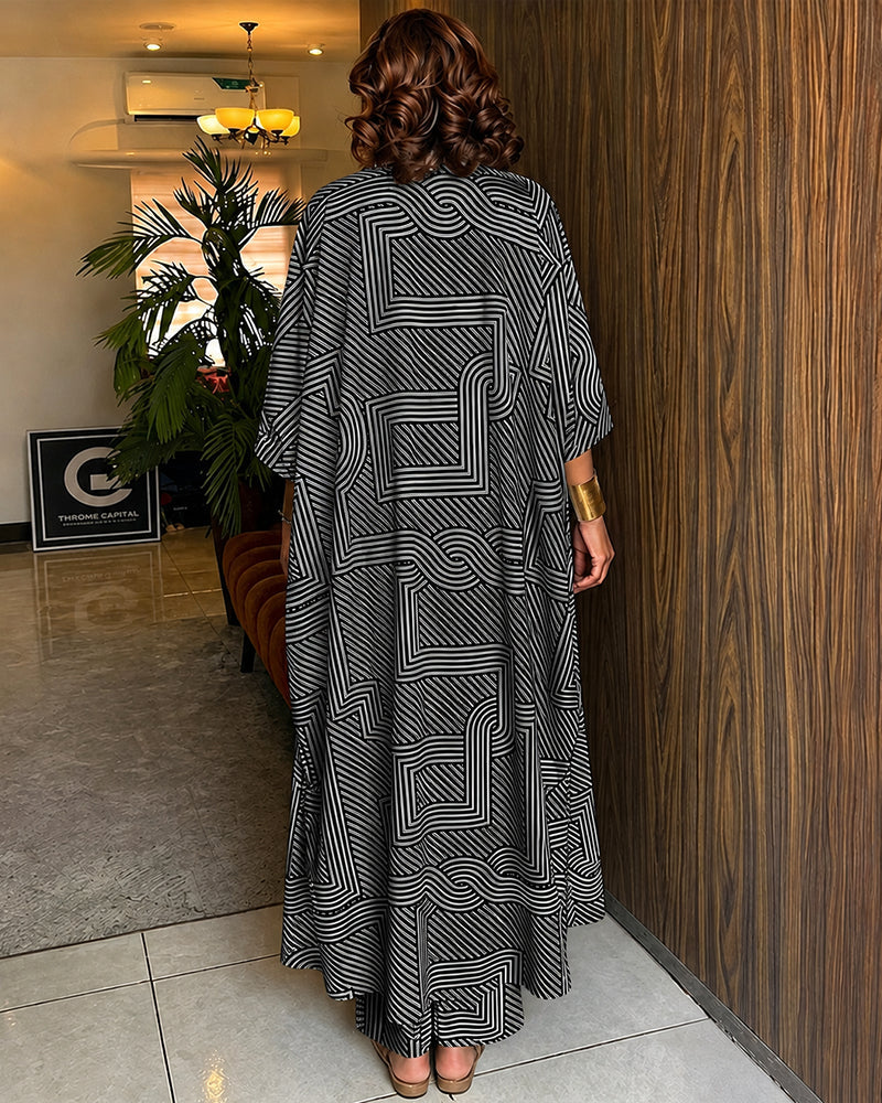 Alira™ | Tweedelige set met geometrische print: loszittende, lange jas met vleermuismouwen en broek met hoge taille en wijde pijpen