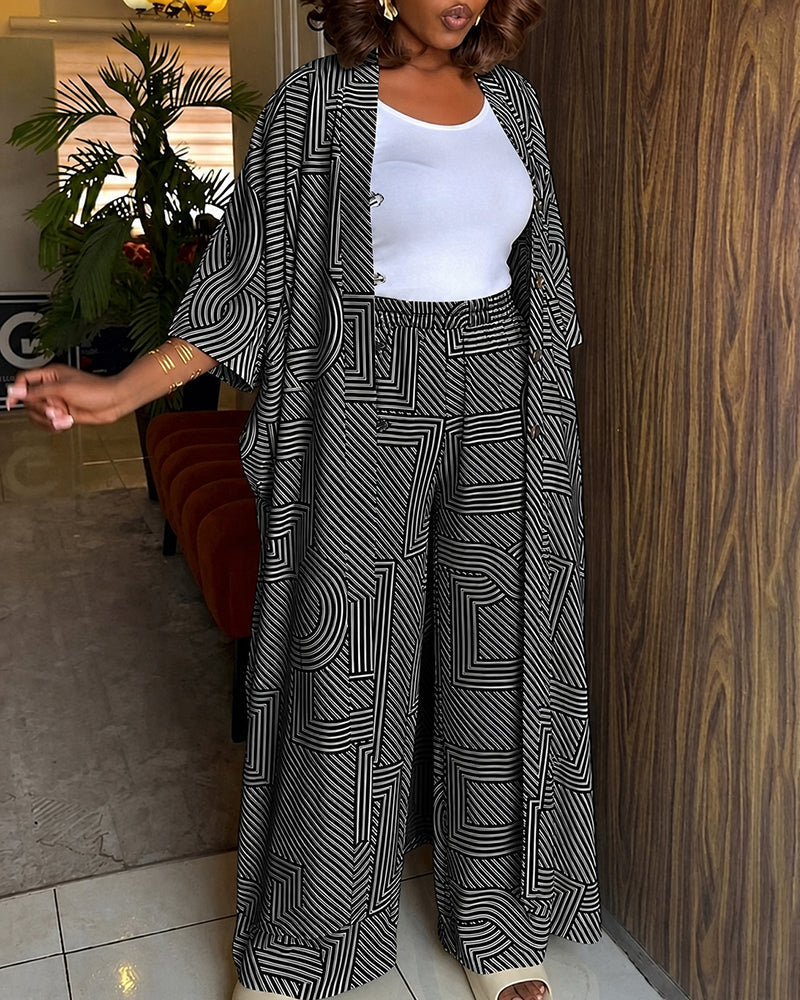Alira™ | Tweedelige set met geometrische print: loszittende, lange jas met vleermuismouwen en broek met hoge taille en wijde pijpen