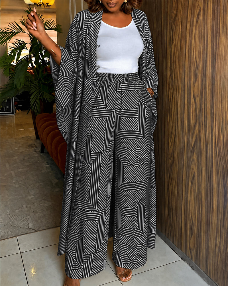 Alira™ | Tweedelige set met geometrische print: loszittende, lange jas met vleermuismouwen en broek met hoge taille en wijde pijpen