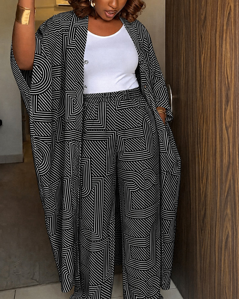 Alira™ | Tweedelige set met geometrische print: loszittende, lange jas met vleermuismouwen en broek met hoge taille en wijde pijpen