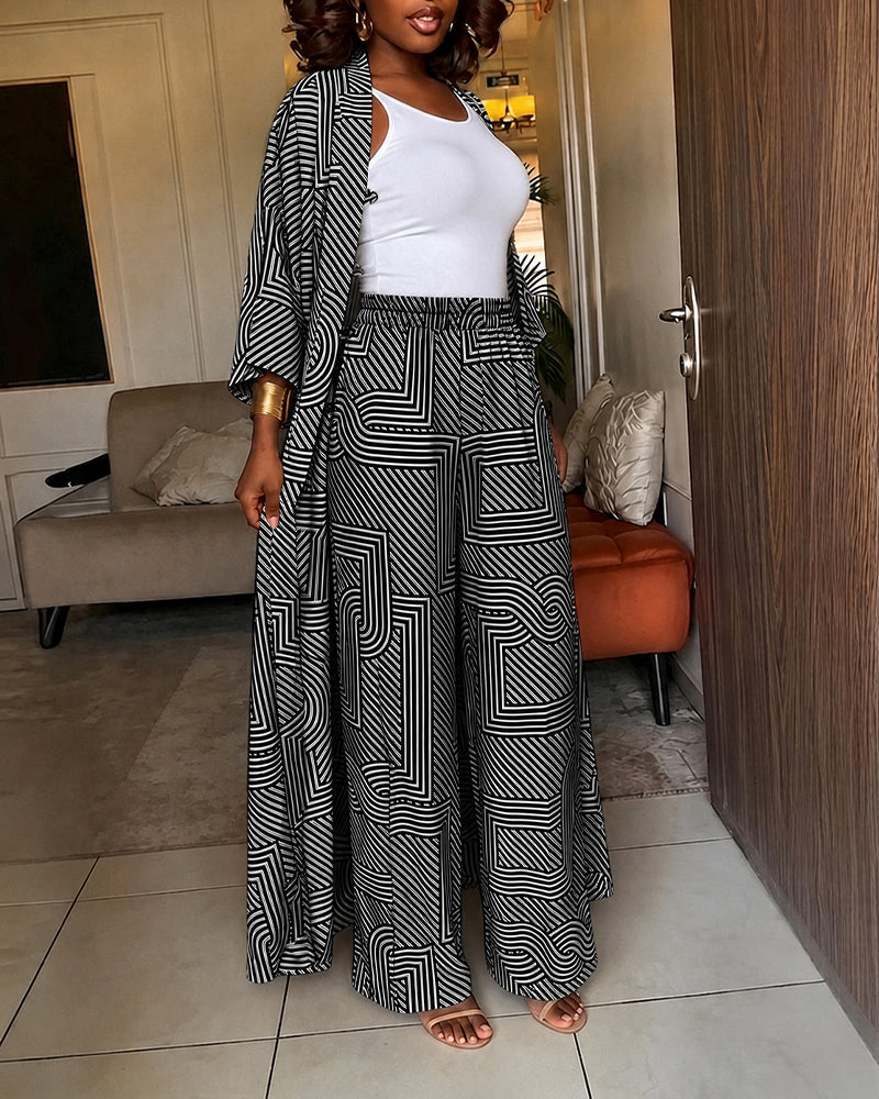 Alira™ | Tweedelige set met geometrische print: loszittende, lange jas met vleermuismouwen en broek met hoge taille en wijde pijpen