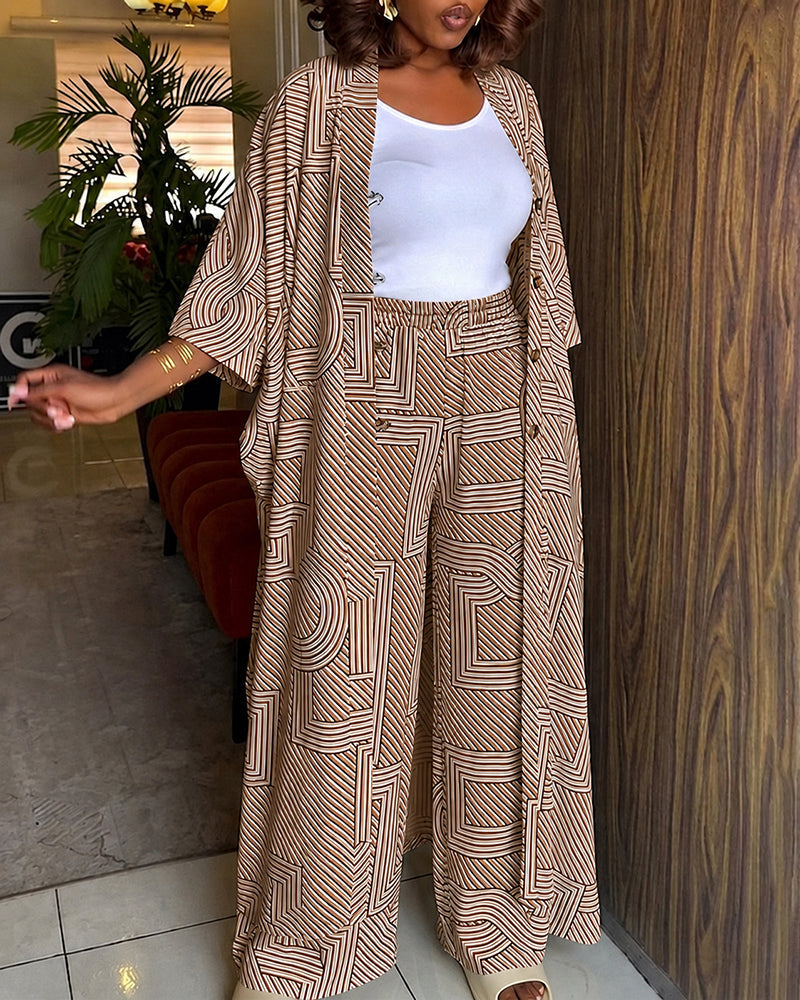 Alira™ | Tweedelige set met geometrische print: loszittende, lange jas met vleermuismouwen en broek met hoge taille en wijde pijpen