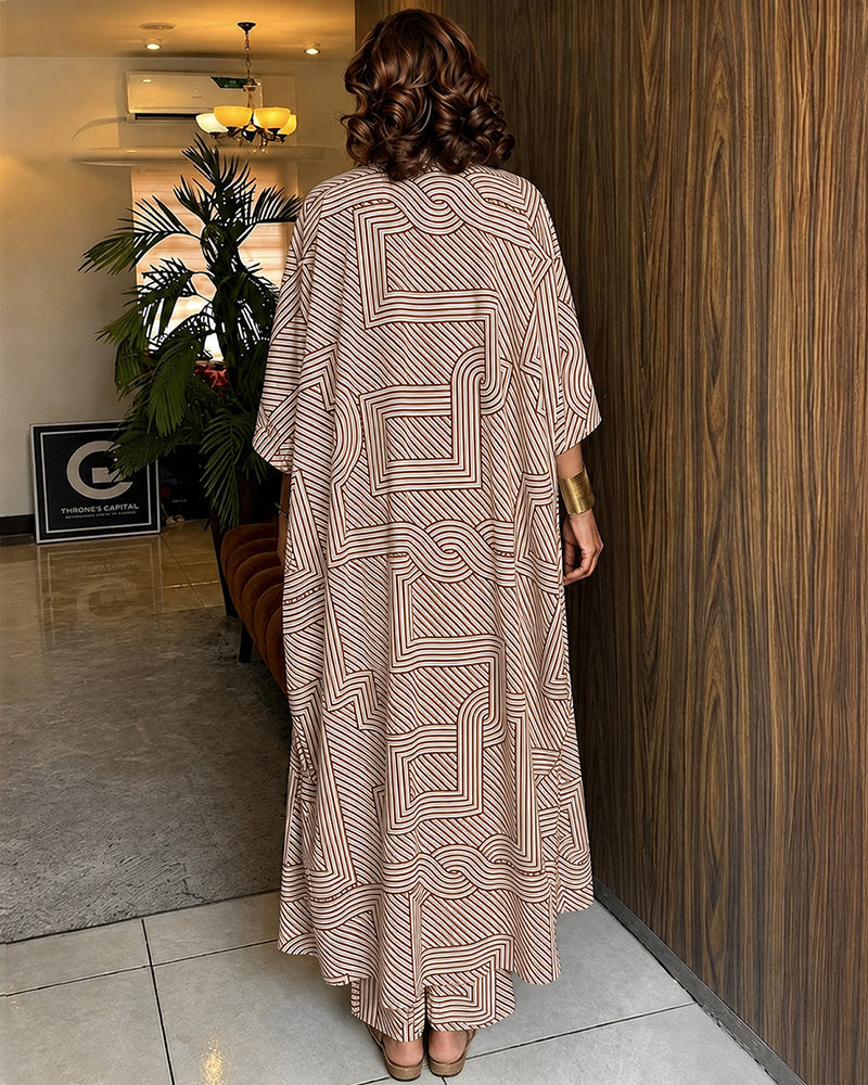 Alira™ | Tweedelige set met geometrische print: loszittende, lange jas met vleermuismouwen en broek met hoge taille en wijde pijpen